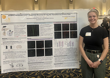Summer Scholar Ellie Gross with her poster at the 2025 Summer Undergraduate Research Conference